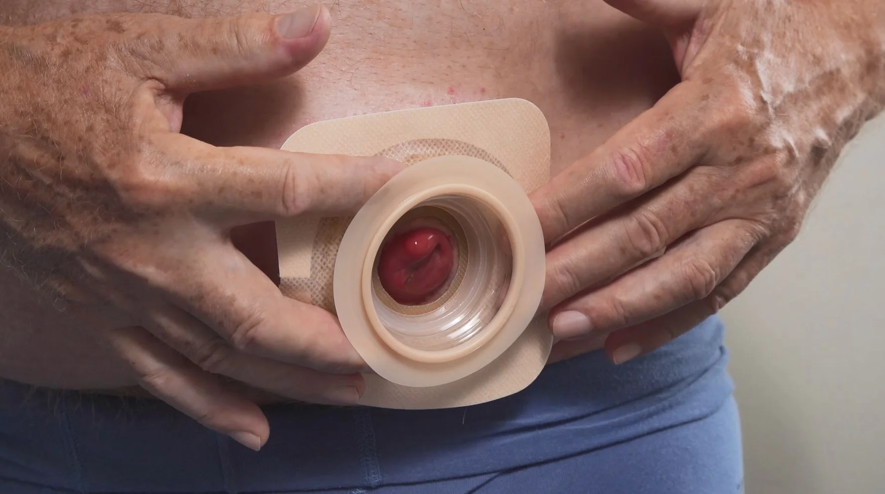 a man holding a white cup