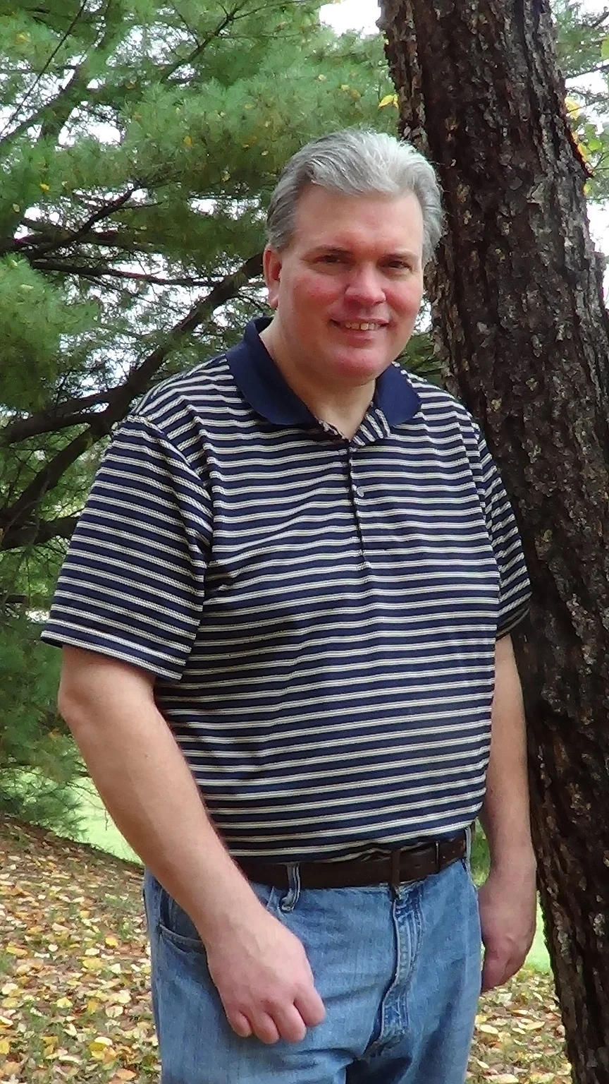 picture of a man living with an ostomy posing outdoors with a smile